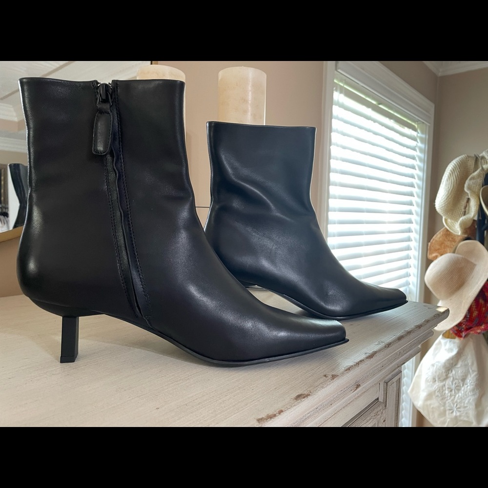 Brand new, in box, sexy black leather unique heeled  ankle boots